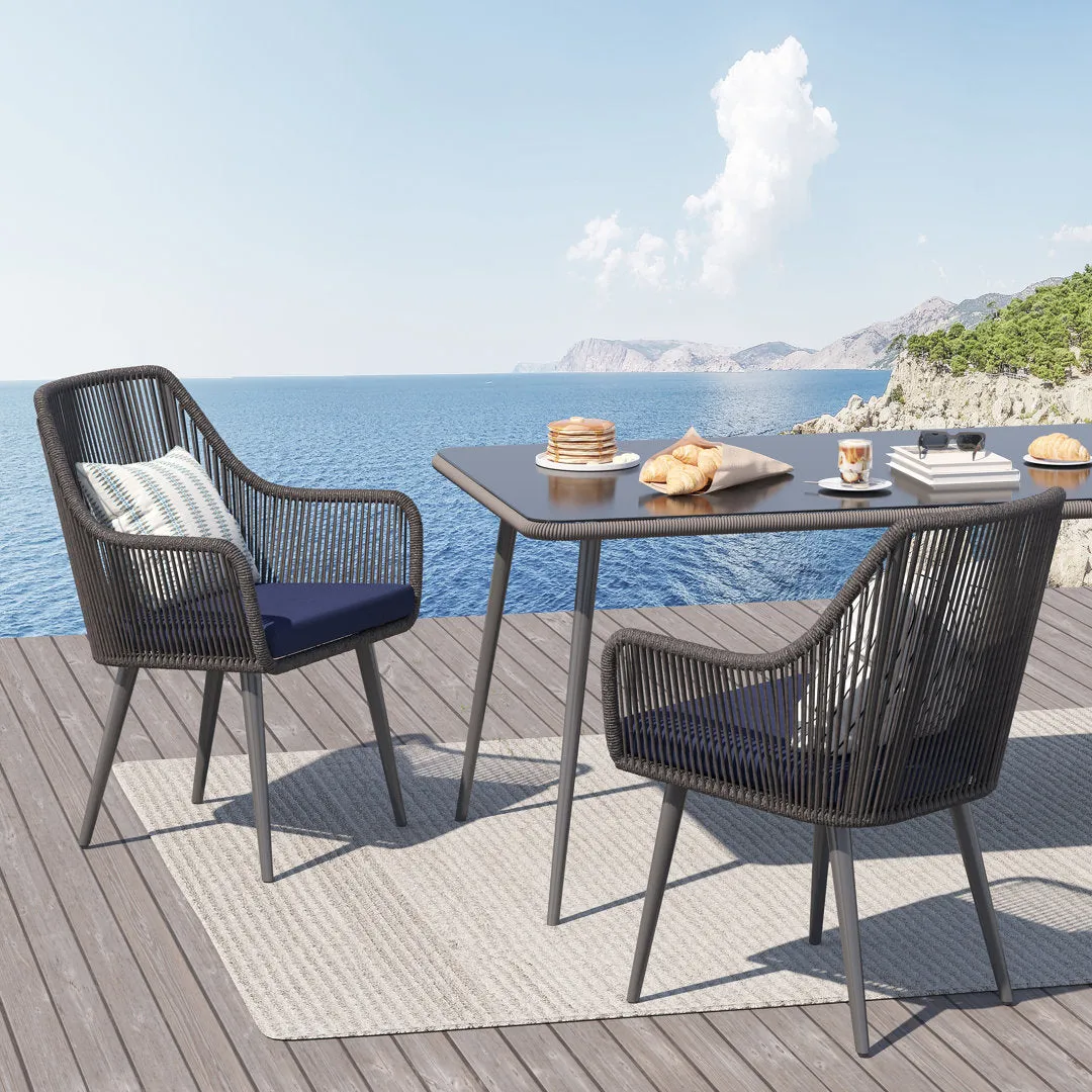 Cassil Patio Dining Armchair with Cushion (Set of 2) Wade Logan® Frame Color/Cushion Color: Black Frame/Navy Cushion